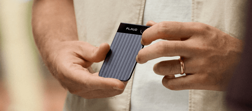 A patient holding a Plaud recorder